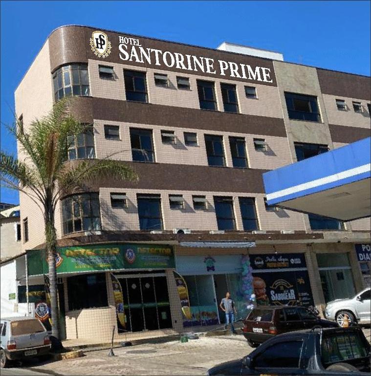 a building with a santino prime sign on it at Hotel Santorine Prime - Itabira in Itabira