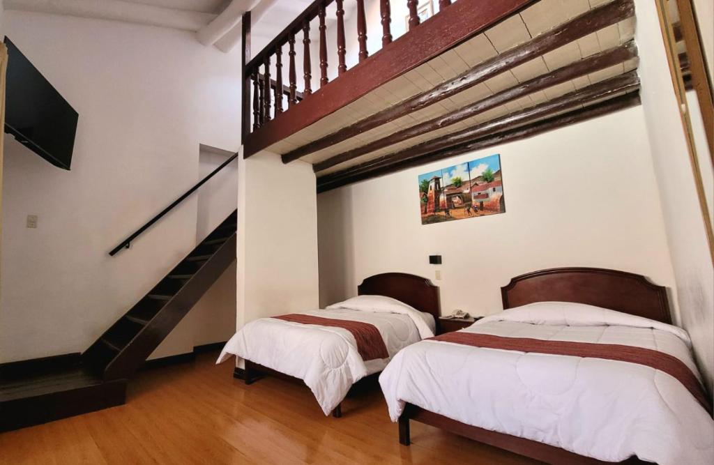 Postel nebo postele na pokoji v ubytování Hotel Cusco Plaza Saphi