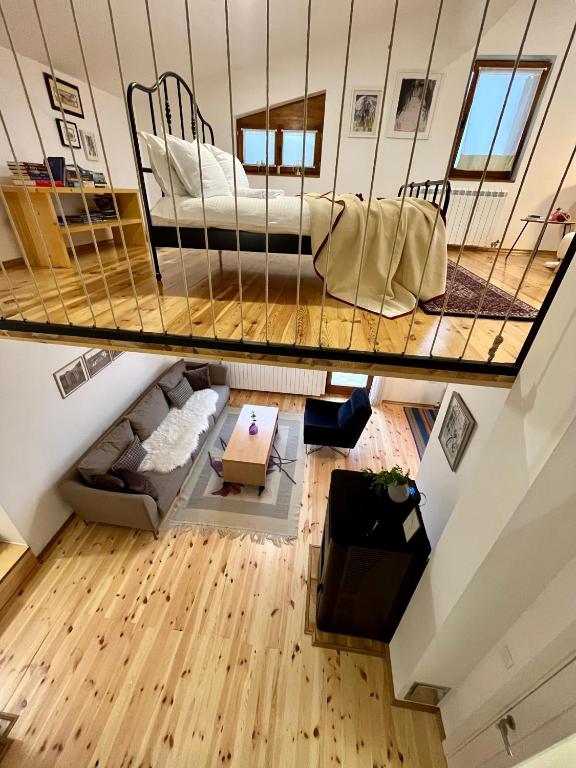 a room with a bed in a loft at Divine House in Žabljak