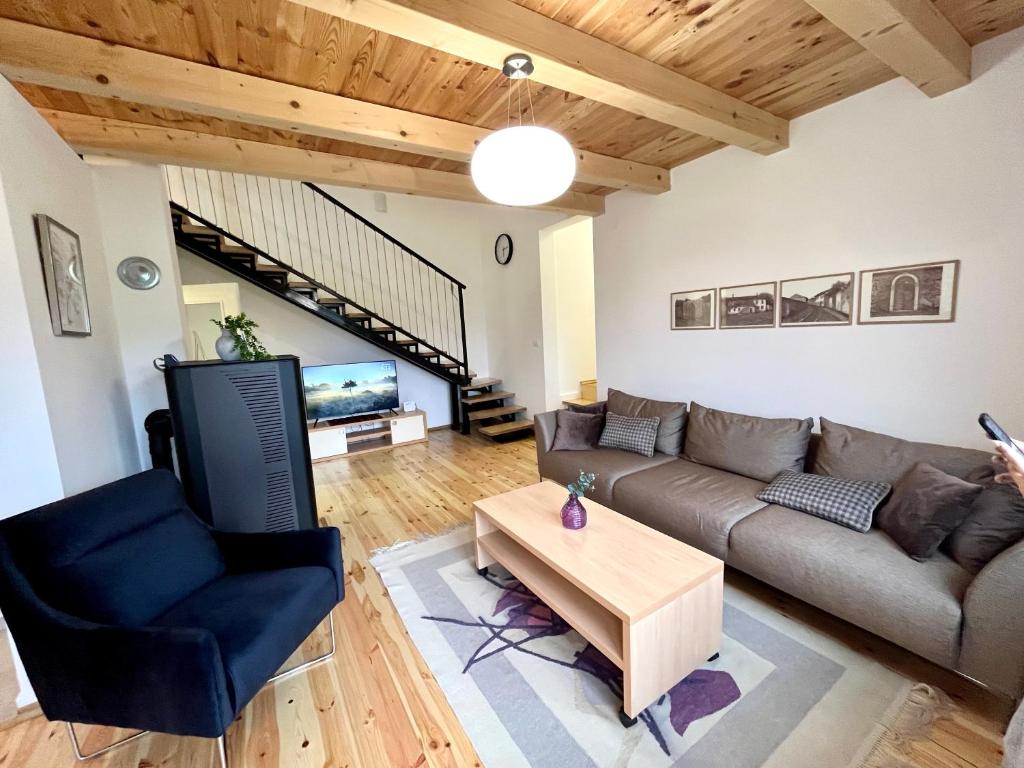 a living room with a couch and a coffee table at Divine House in Žabljak