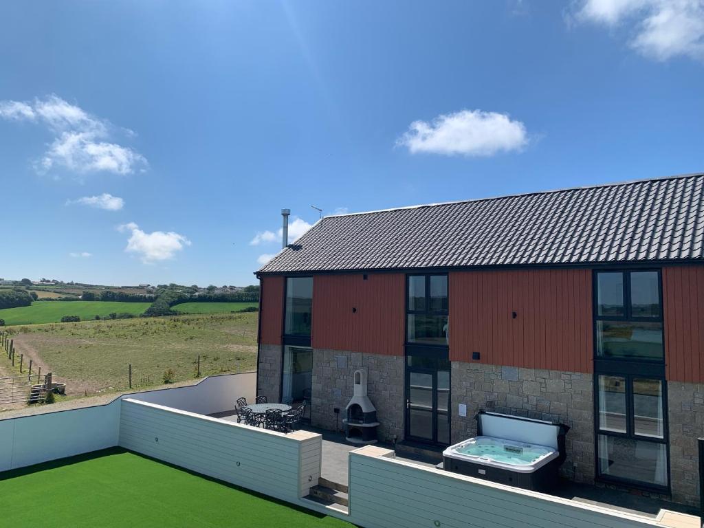 an aerial view of a house with a roof at Valley View in Helston