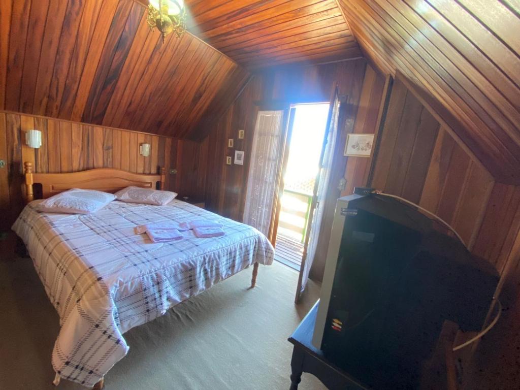 Ένα ή περισσότερα κρεβάτια σε δωμάτιο στο Casa aconchegante pertinho de tudo, ótima localização.