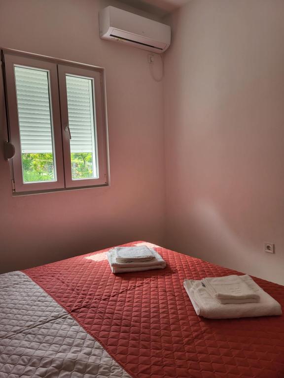 Postel nebo postele na pokoji v ubytování Novi Relax apartment