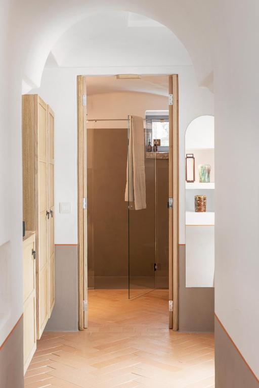 a hallway with a door open to a bathroom at Masseria Auraterrae in Polignano a Mare