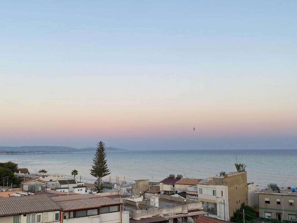 a view of the ocean from a city at Villa Maresa Home in Realmonte