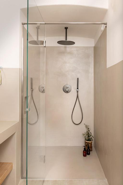 a shower with a glass door in a bathroom at Masseria Auraterrae in Polignano a Mare
