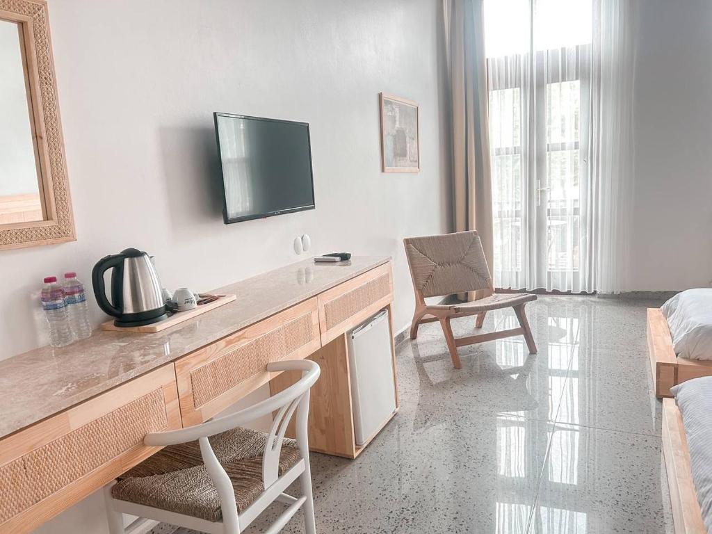 TV a/nebo společenská místnost v ubytování Eden Selene Hotel