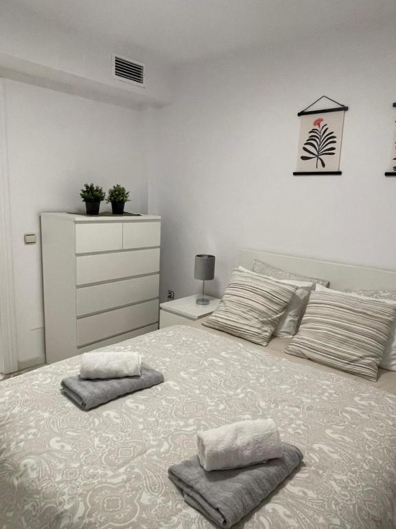 Postel nebo postele na pokoji v ubytování Jardines Apartment