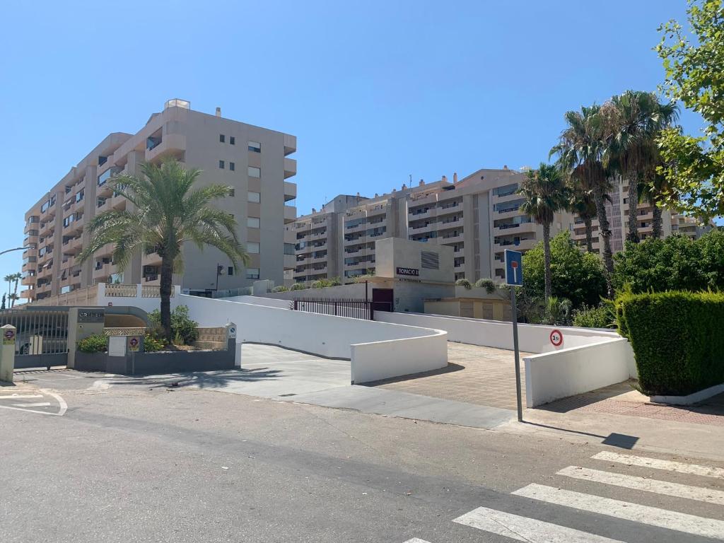 a parking lot in a city with tall buildings at SERVICE APART LAZARO TOPACIO 3 in Calpe