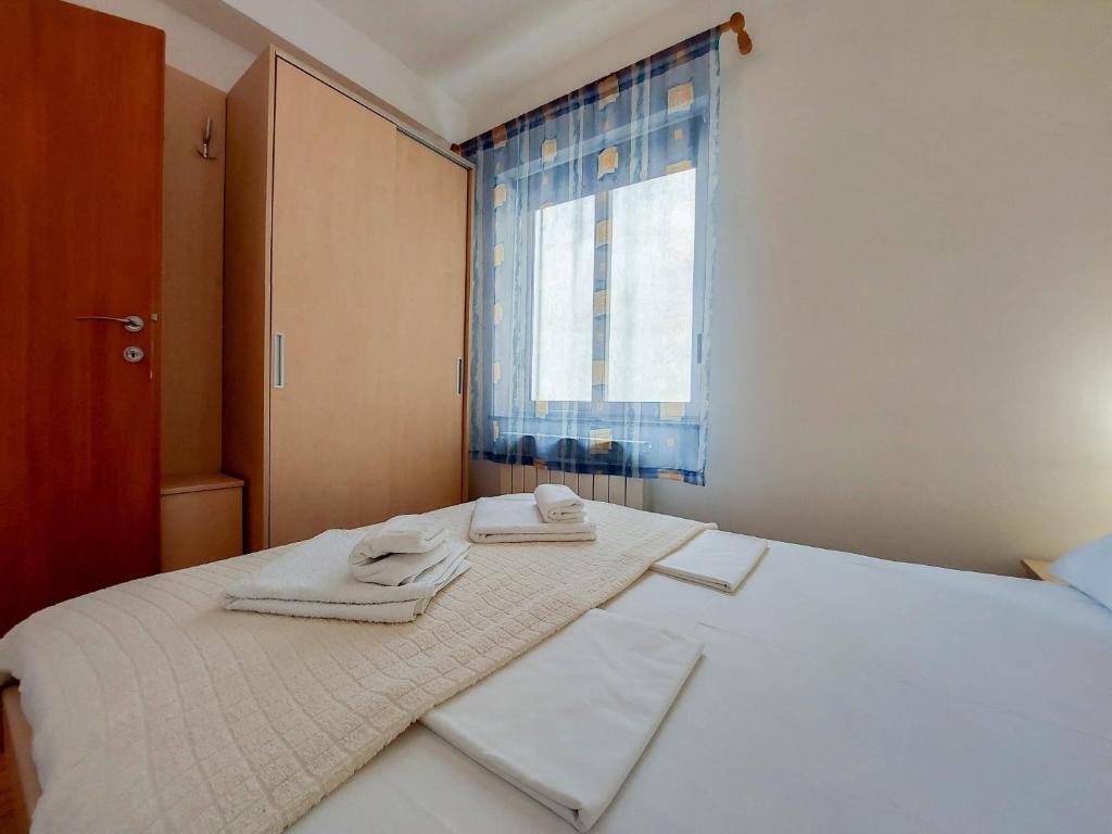Postel nebo postele na pokoji v ubytování Apartments Zeljko