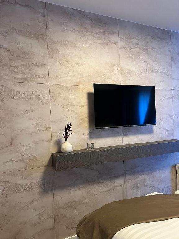 TV a/nebo společenská místnost v ubytování Hotel Harmshof Bispingen