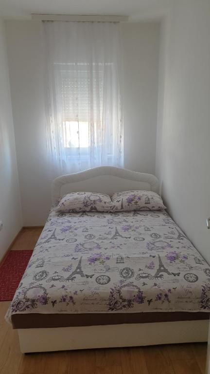 Postel nebo postele na pokoji v ubytování Apartmani Borko 3-2