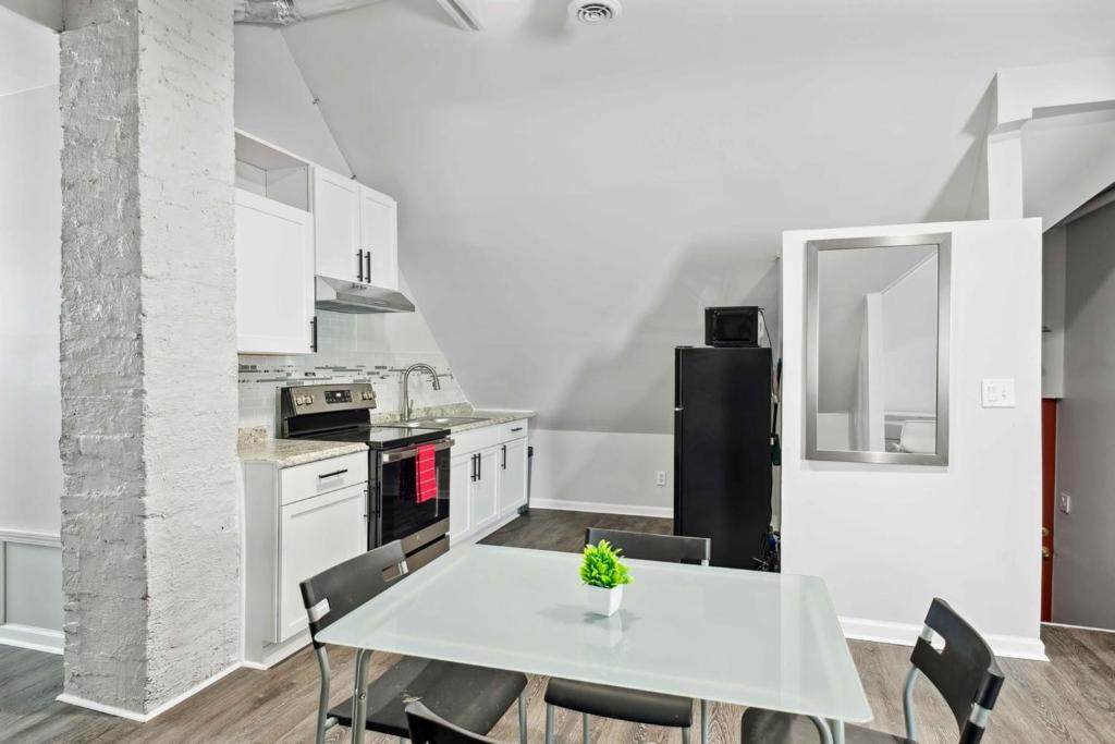 a kitchen with a white table and chairs at Detroit 2Bd Christmas Holiday Museums Parks in Detroit