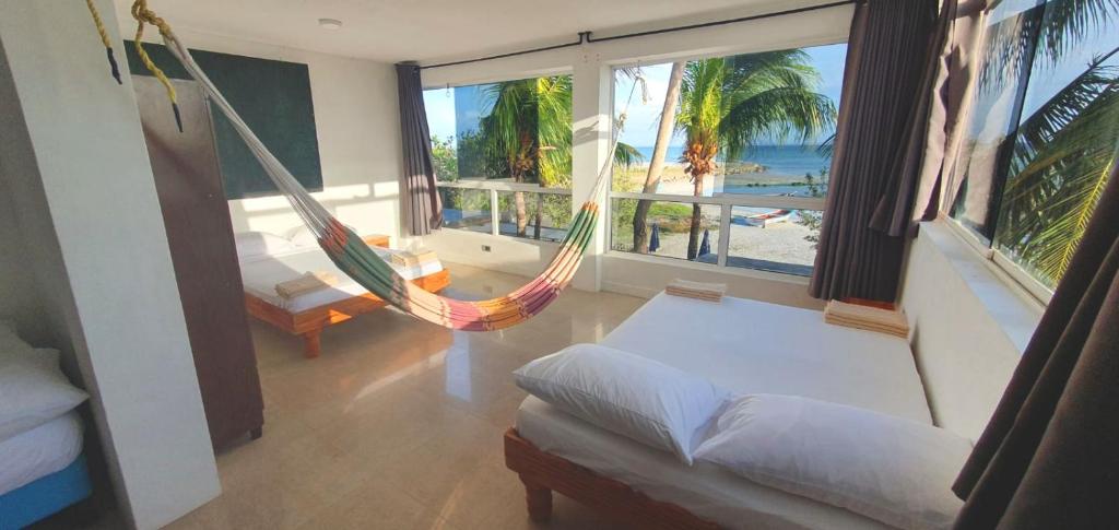 Postel nebo postele na pokoji v ubytování Casa Maya Playa El Yaque