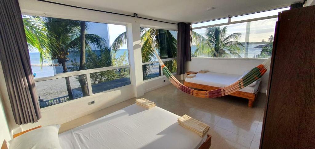 Postel nebo postele na pokoji v ubytování Casa Maya Playa El Yaque