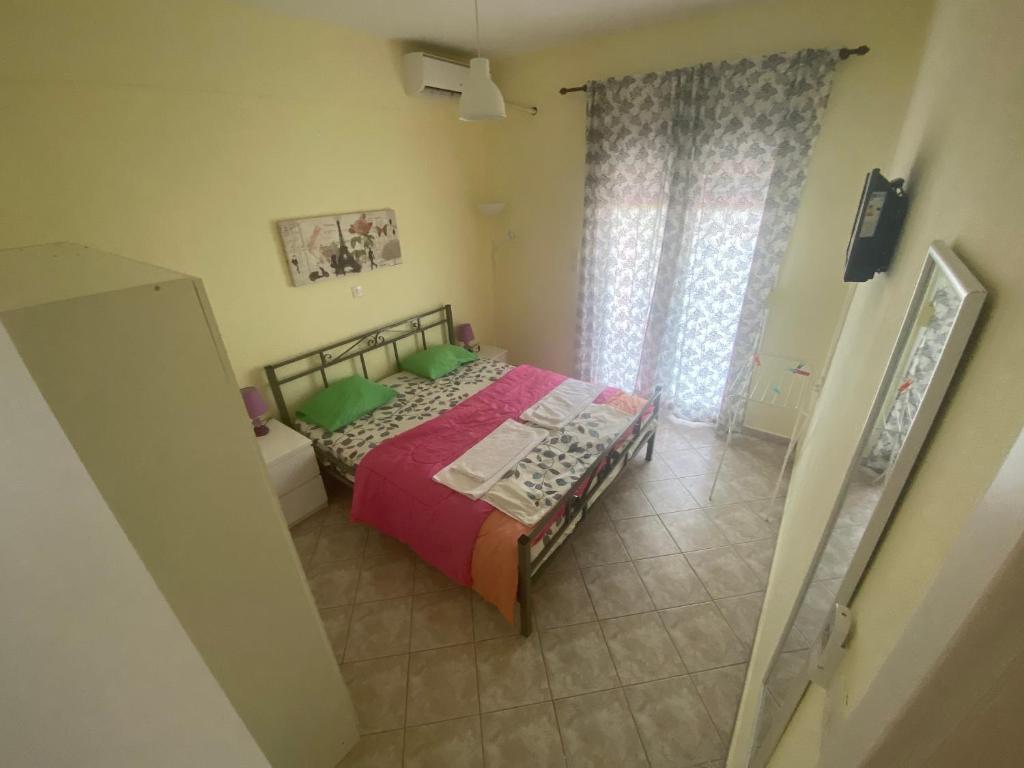 Postel nebo postele na pokoji v ubytování Kelesi Apartments