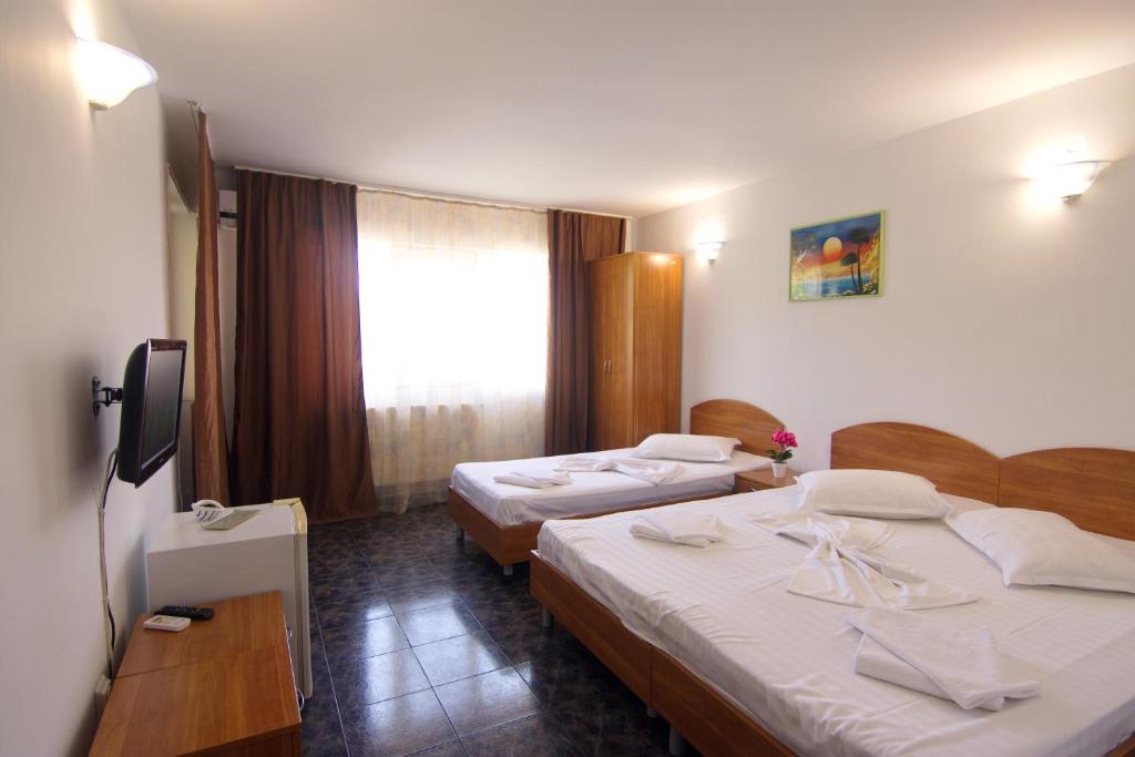 Postel nebo postele na pokoji v ubytování Vila Jasp