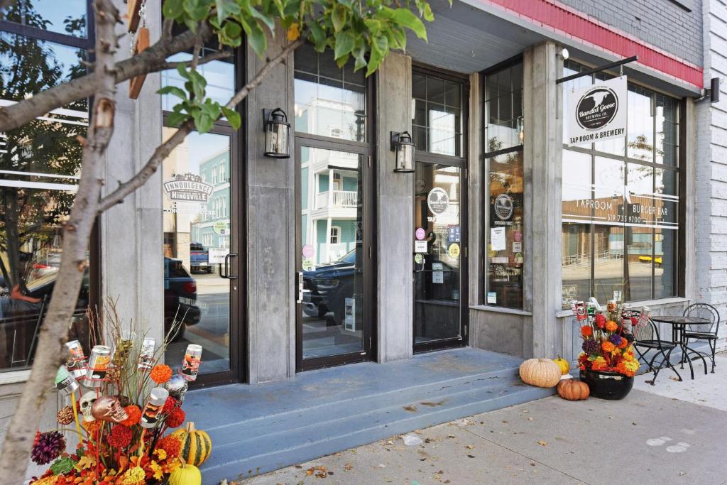 a store front with pumpkins in front of it at Inn 15 Brewery Loft Suites in Kingsville