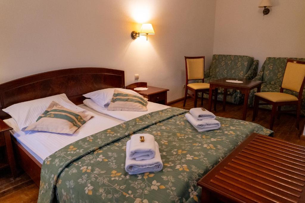 Posteľ alebo postele v izbe v ubytovaní Aparthotel Karmel