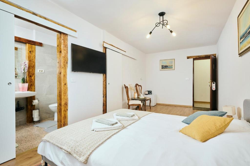 Postel nebo postele na pokoji v ubytování San Marco Rooms Umag