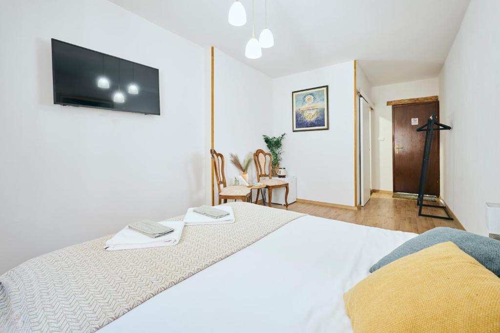 Postel nebo postele na pokoji v ubytování San Marco Rooms Umag