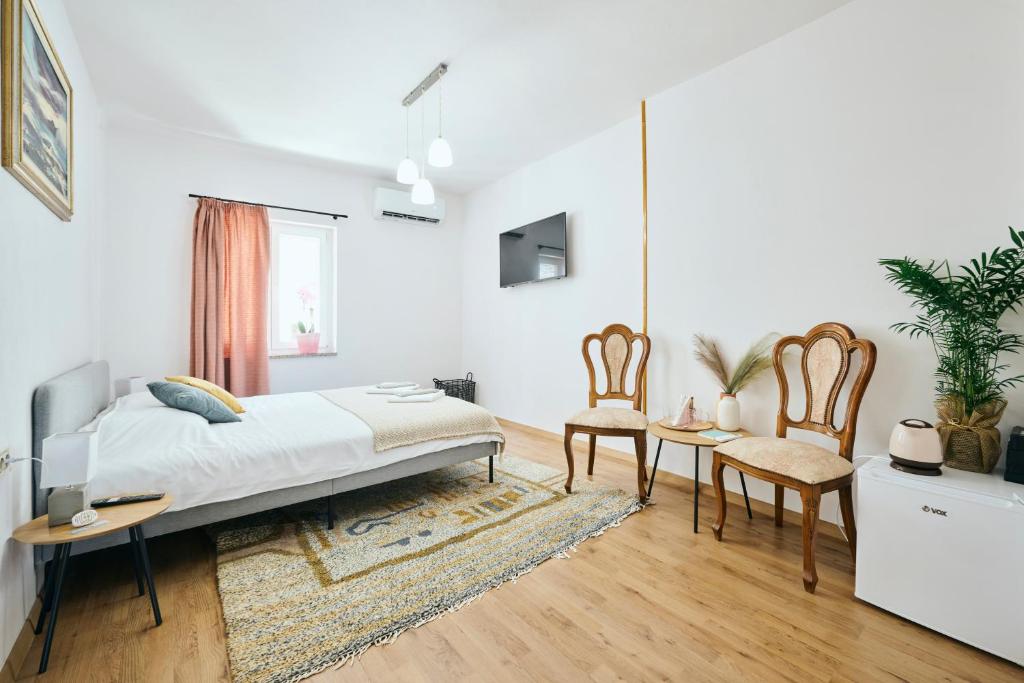 Postel nebo postele na pokoji v ubytování San Marco Rooms Umag