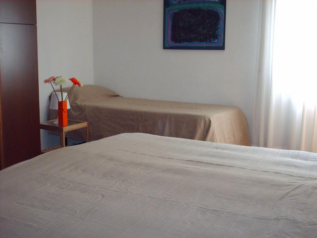 Postel nebo postele na pokoji v ubytování Guest House Cuore del Friuli