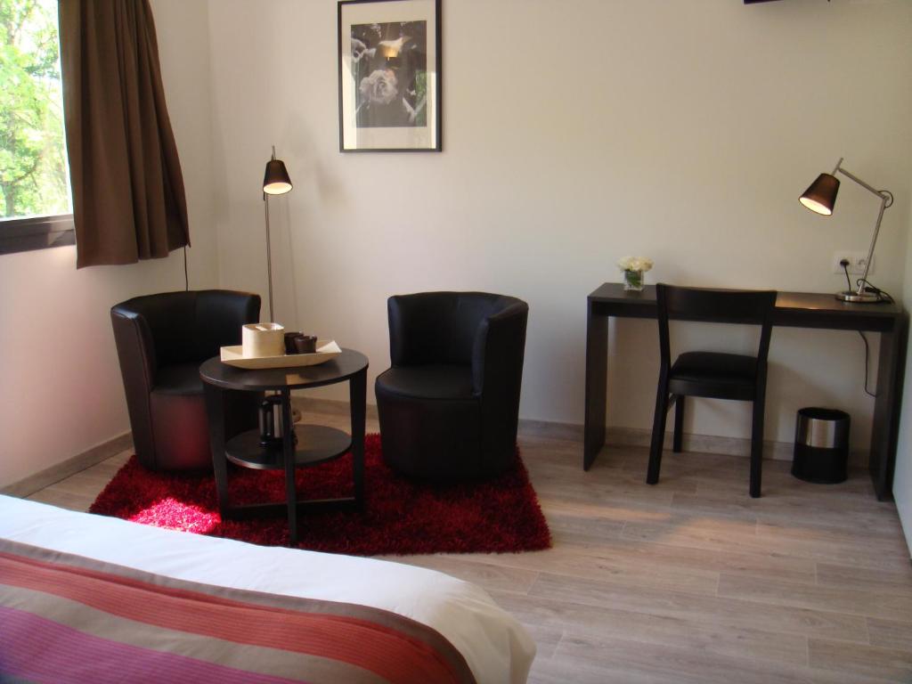 Postel nebo postele na pokoji v ubytování Côté Hôtel