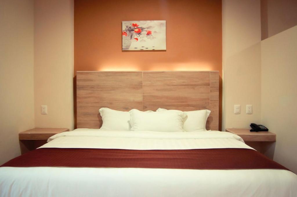 Postel nebo postele na pokoji v ubytování Hotel Luna Caribe