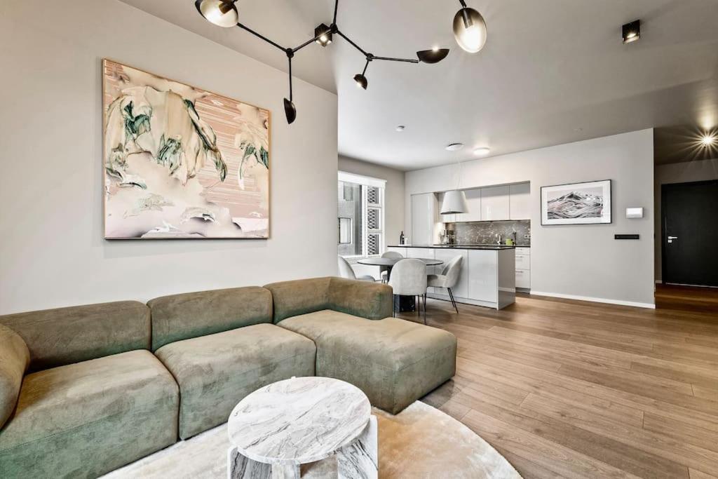 a living room with a couch and a table at Private Lux 2BR & 2BA City Center with Free Parking in Reykjavík