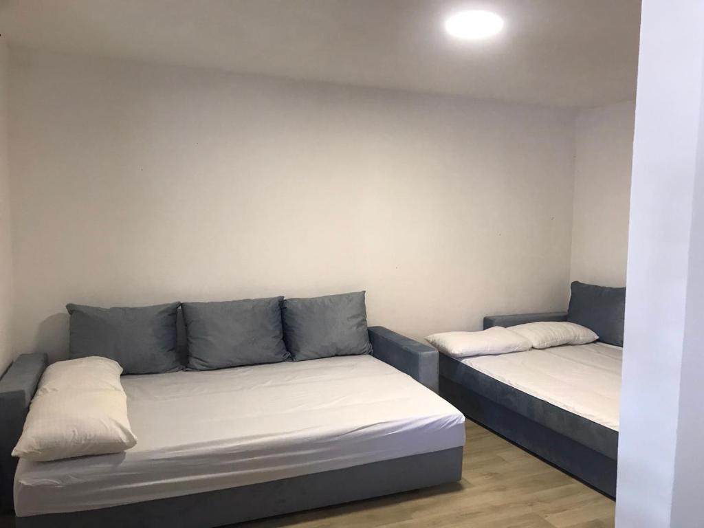 Postel nebo postele na pokoji v ubytování Mondeno apartments