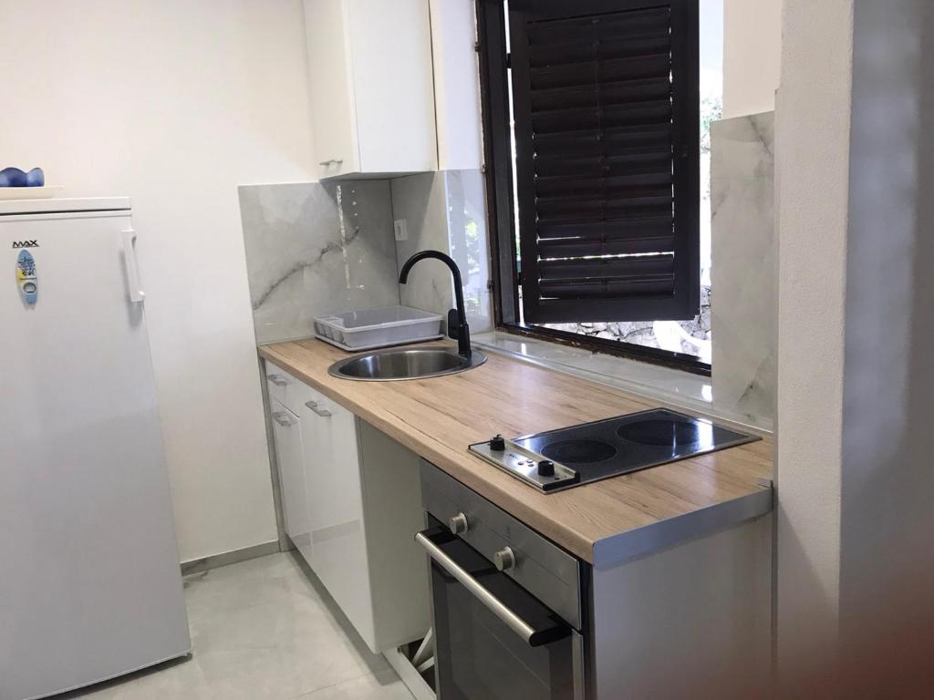 Kuchyň nebo kuchyňský kout v ubytování Mondeno apartments