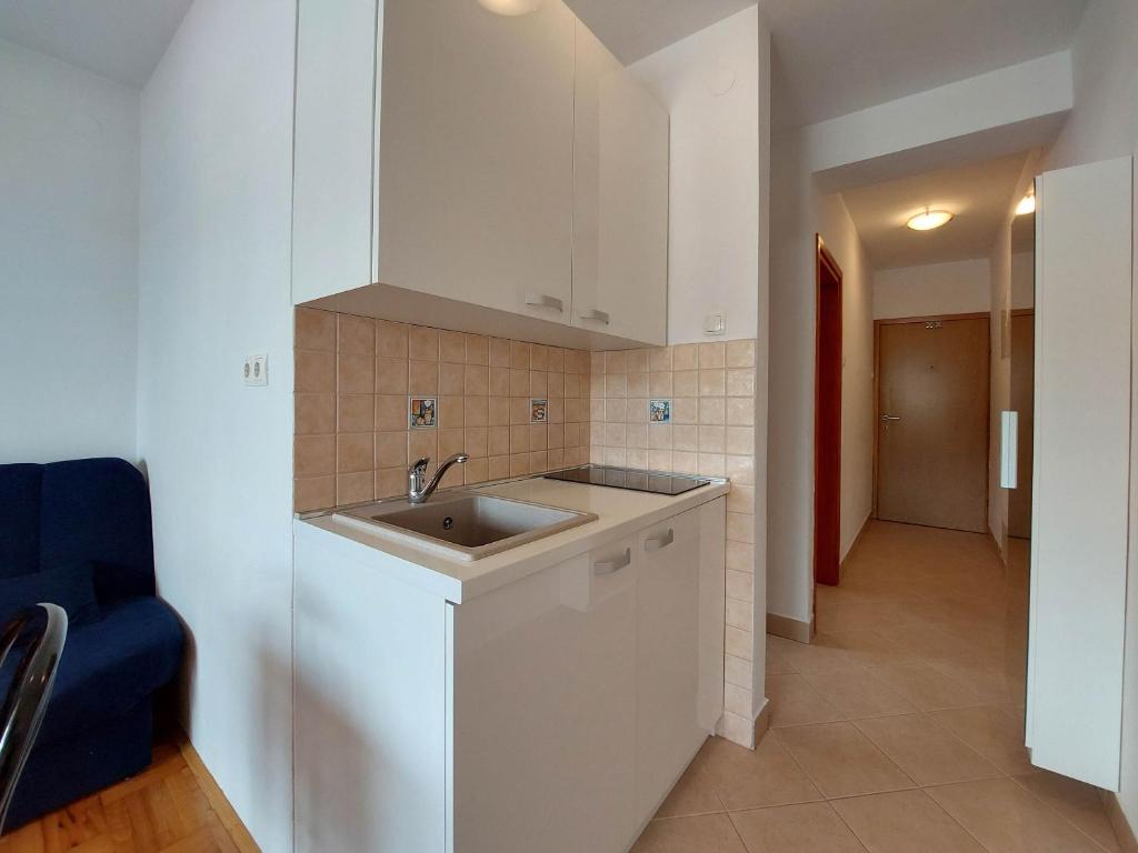 Kuchyň nebo kuchyňský kout v ubytování Apartments Zeljko