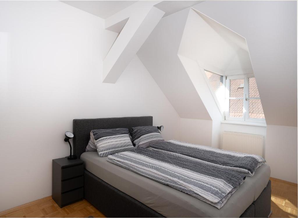 Postel nebo postele na pokoji v ubytování Apartment inmitten der Stadt Leoben.