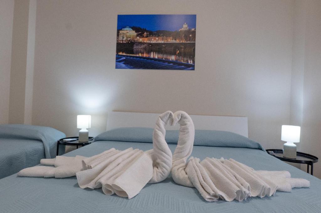 Säng eller sängar i ett rum på Umberto I Nicosia
