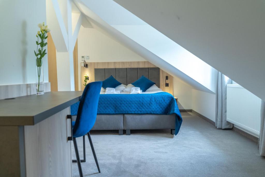 Posteľ alebo postele v izbe v ubytovaní Hotel Alpin