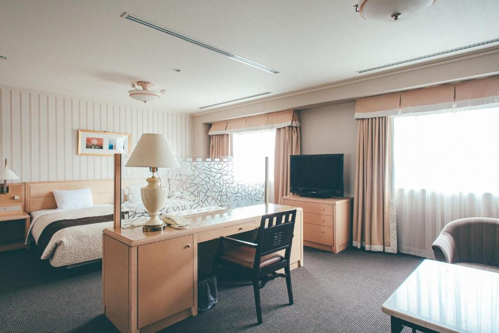 Voodi või voodid majutusasutuse Numazu River Side Hotel toas