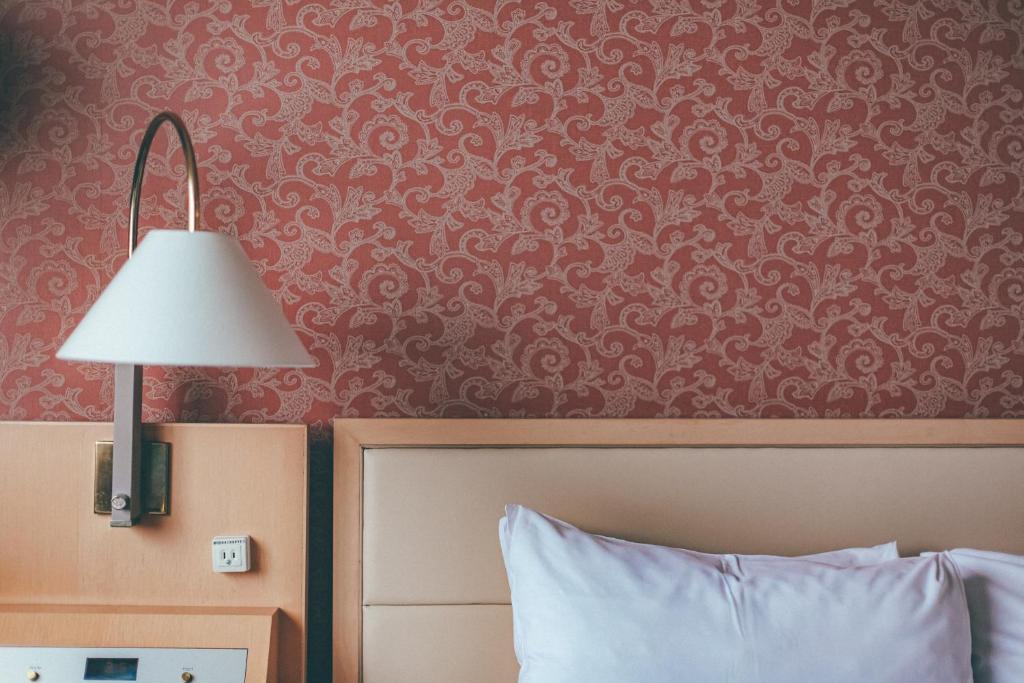 Voodi või voodid majutusasutuse Numazu River Side Hotel toas