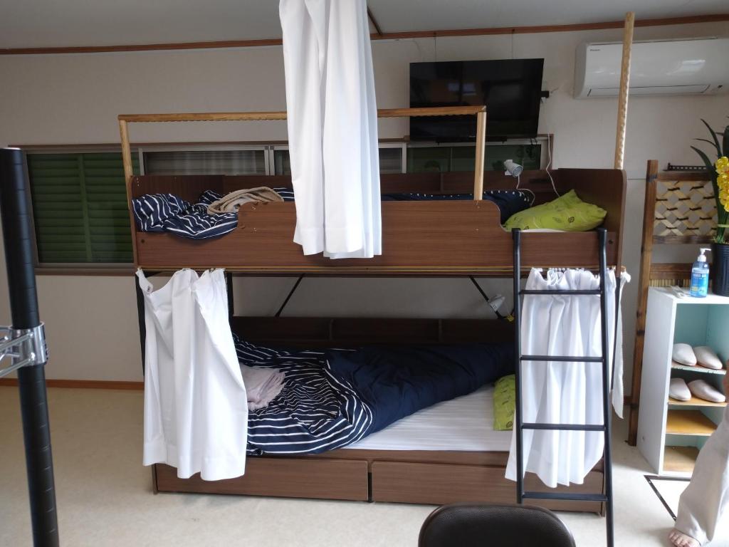 Letto o letti in una camera di コウノトリの里の宿