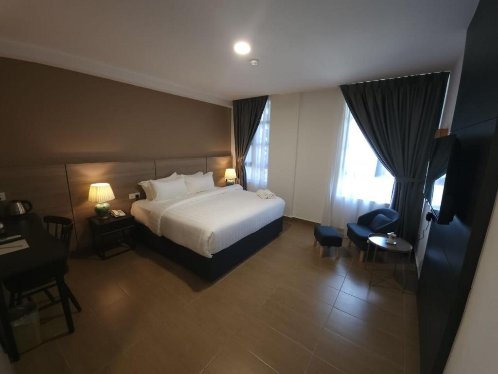 Postel nebo postele na pokoji v ubytování Yu Hotel Chinatown