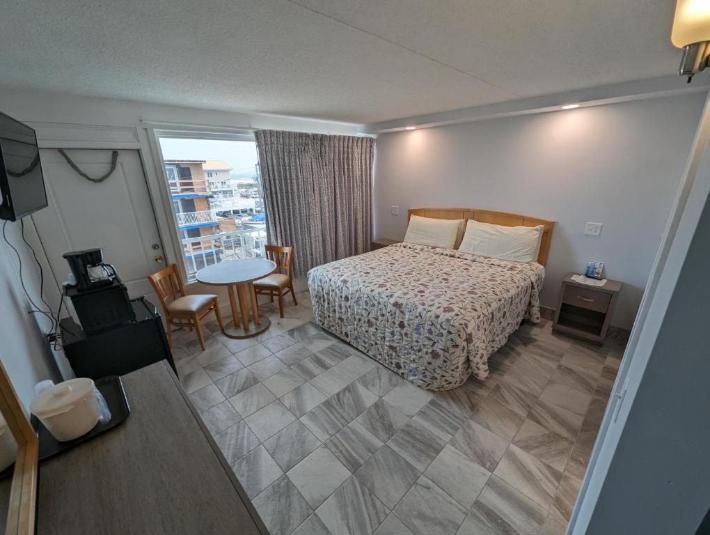 Postel nebo postele na pokoji v ubytování Admiral Resort Motel
