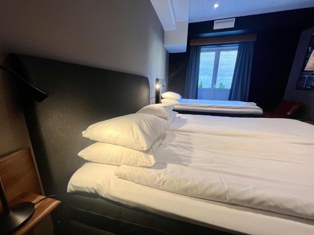 Postel nebo postele na pokoji v ubytování Hotell Siesta
