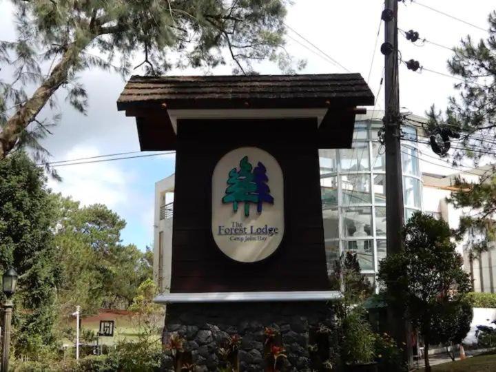 a sign for a littlefield lodge sitting in front of a building at The Forest Lodge at Camp John Hay privately owned unit with parking 265 in Baguio