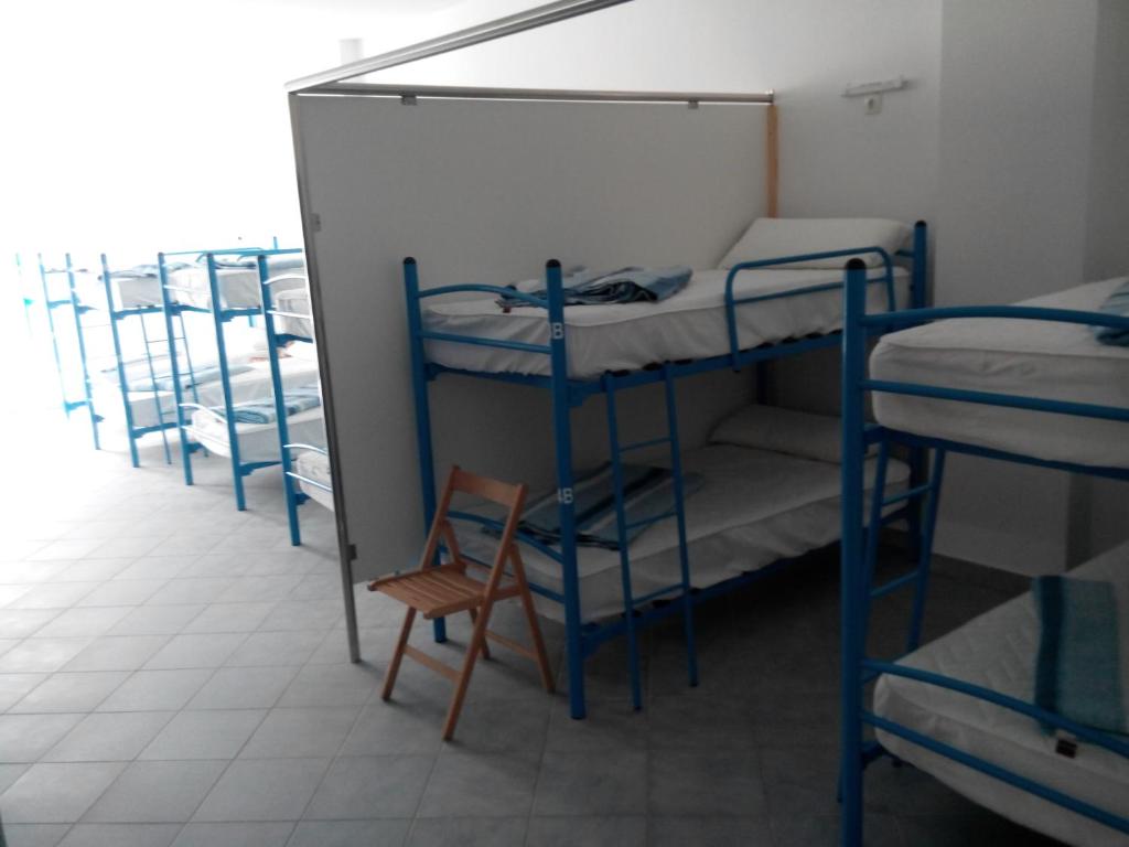 Postel nebo postele na pokoji v ubytování Albergue @ Muxia