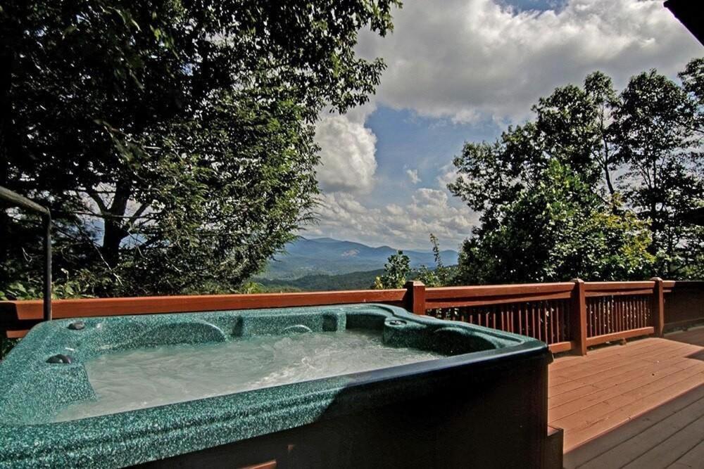 a hot tub on the deck of a house at Stargazer in Ellijay