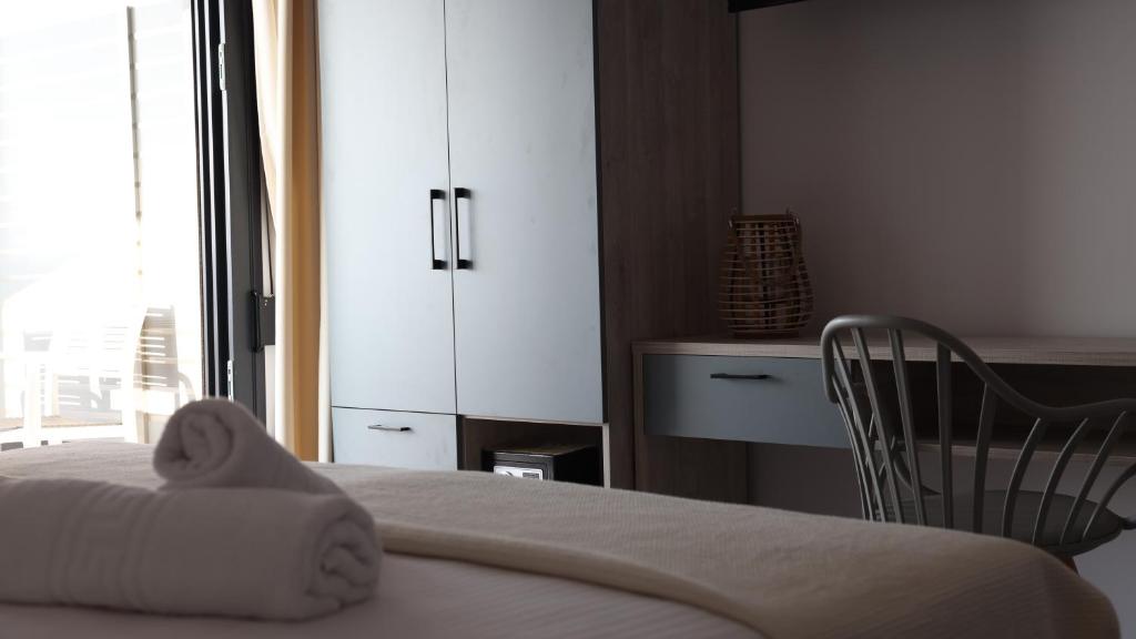 Postel nebo postele na pokoji v ubytování Nautico Rooms