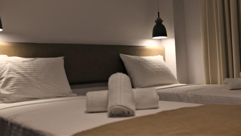 Postel nebo postele na pokoji v ubytování Nautico Rooms