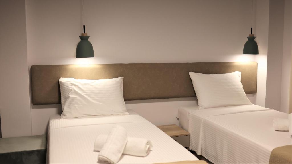 Postel nebo postele na pokoji v ubytování Nautico Rooms