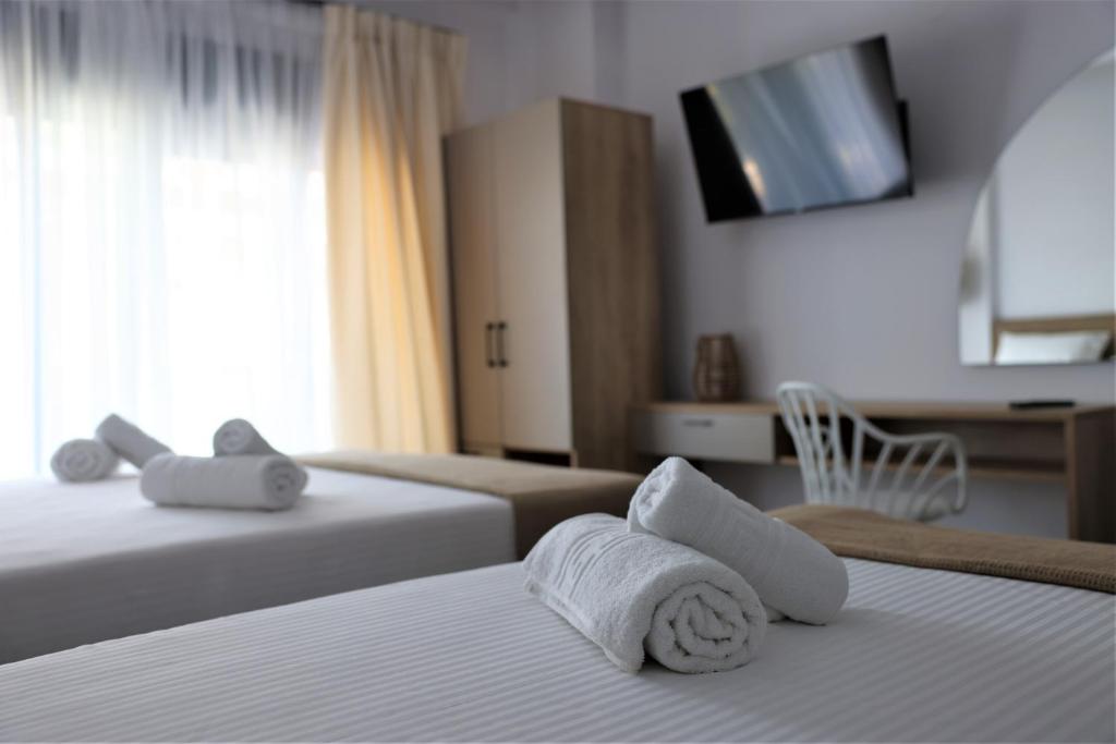 Postel nebo postele na pokoji v ubytování Nautico Rooms