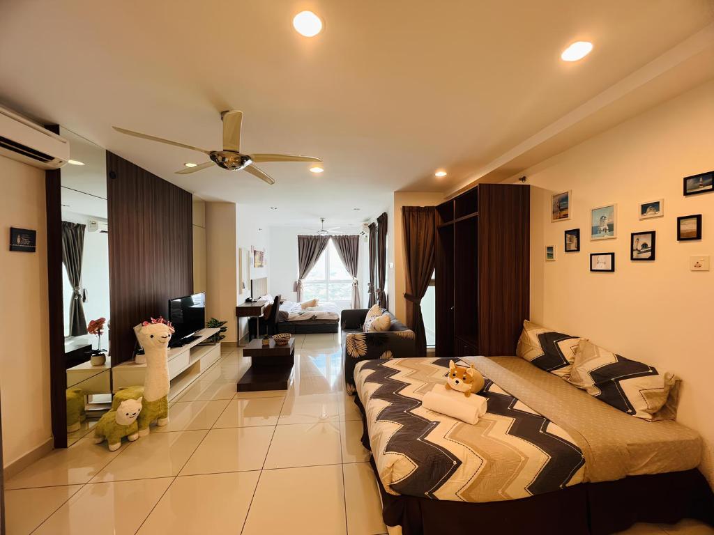 a bedroom with a bed and a living room at Mansion One by PerfectSweetHome in George Town